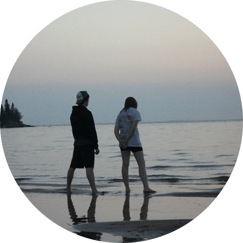 Eric and Nilah standing on the beach